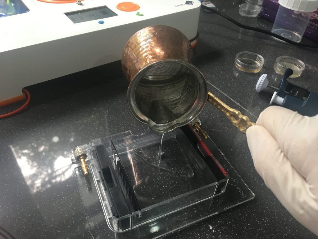 Pouring agarose from a traditional Turkish coffee pot.