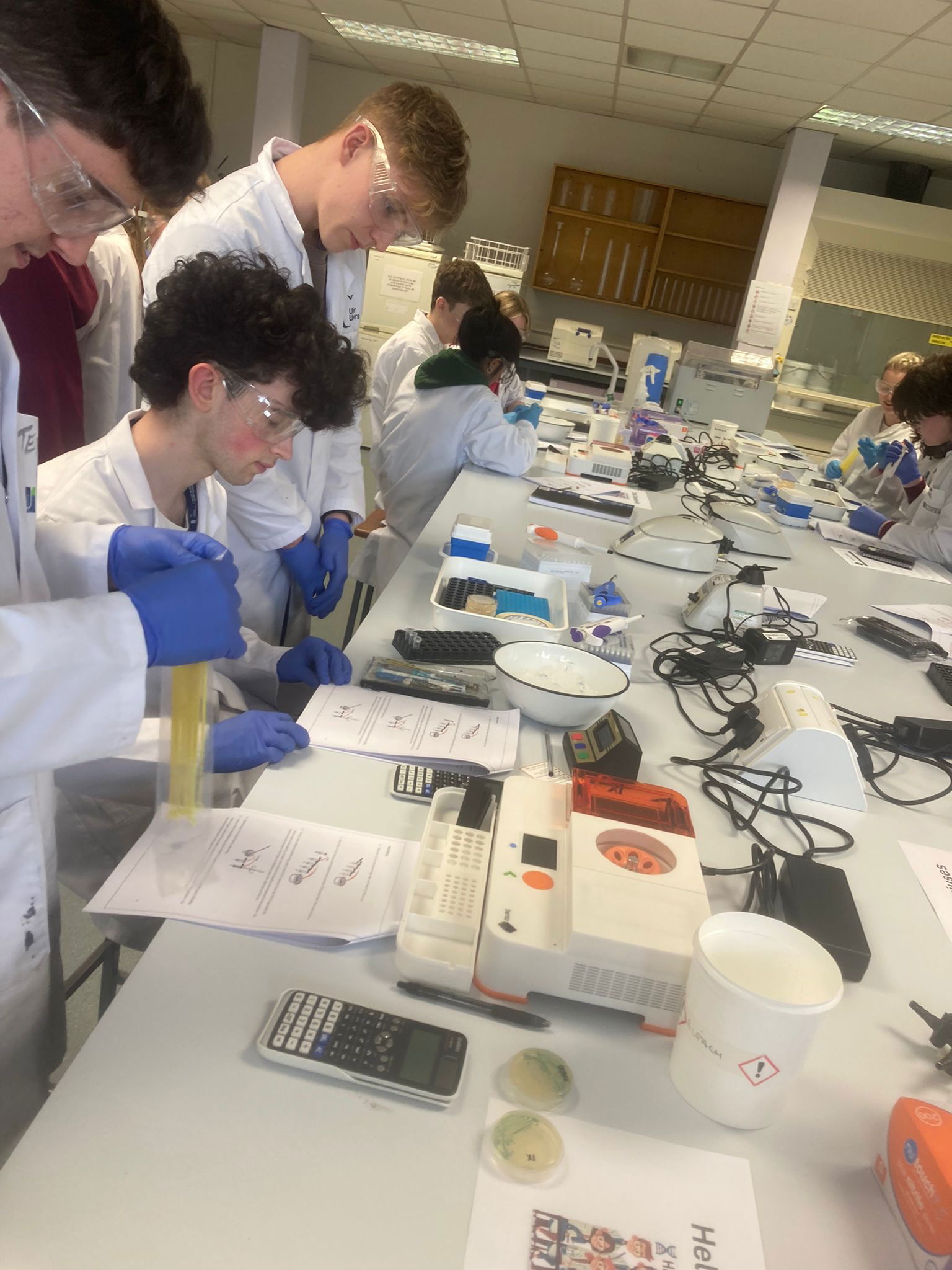 UGenie students concentrating as they start experiments